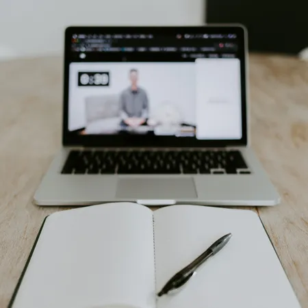 Laptop computer with notebook and pen