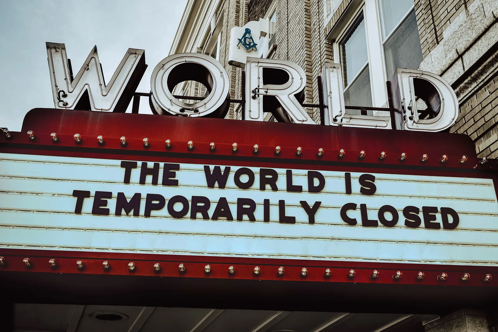 Old theatre billboard sign with the words the world is unavailable