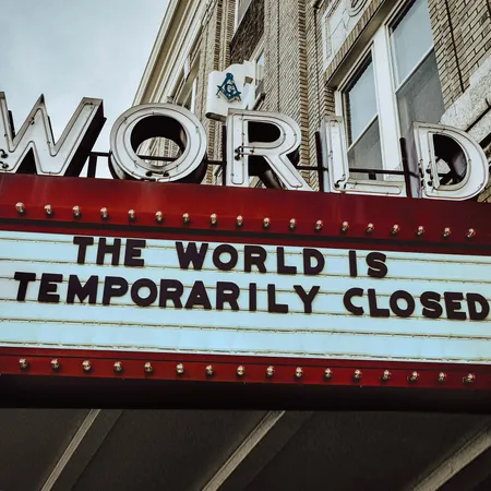 Old theatre billboard sign with the words the world is unavailable