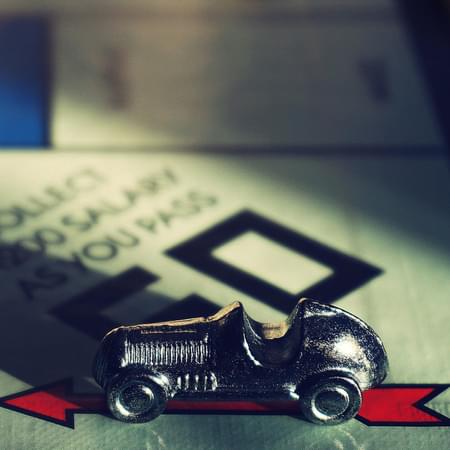 monopoly board games with a pewter car