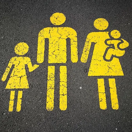 road sign with yellow family